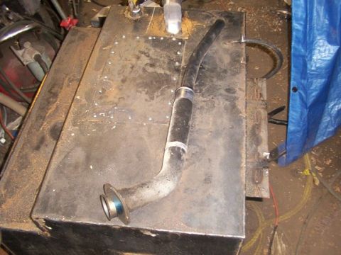 1995 Ford C-350 (Centurion Conversions) - A custom fuel tank with a filler neck and hose is shown, likely for a vehicle modification.