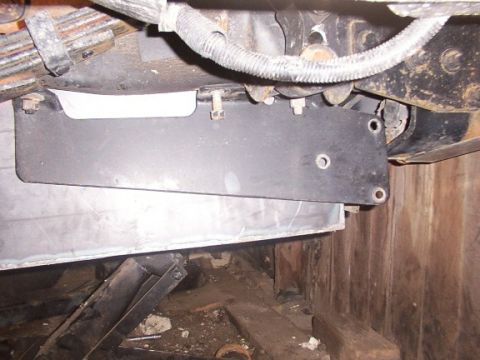 1995 Ford C-350 (Centurion Conversions) - Underside view of a custom fuel tank assembly with visible suspension components.