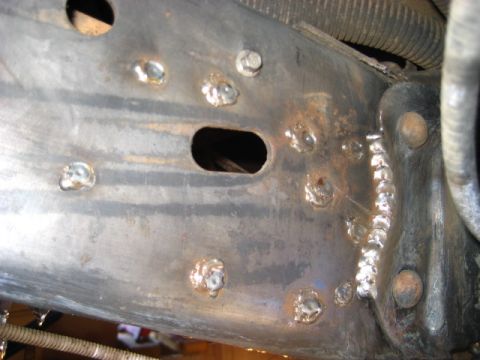 1989 Ford Bronco - This image shows a section of a vehicle's frame, heavily modified with welds and bolts, with no clear year identification.