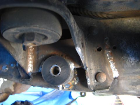 1989 Ford Bronco - Undercarriage view showing suspension components and frame modifications.