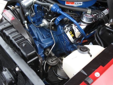 1968 Shelby GT500 - Close-up of a 1968 Shelby GT500 engine bay, showing the blue engine block and chrome details.
