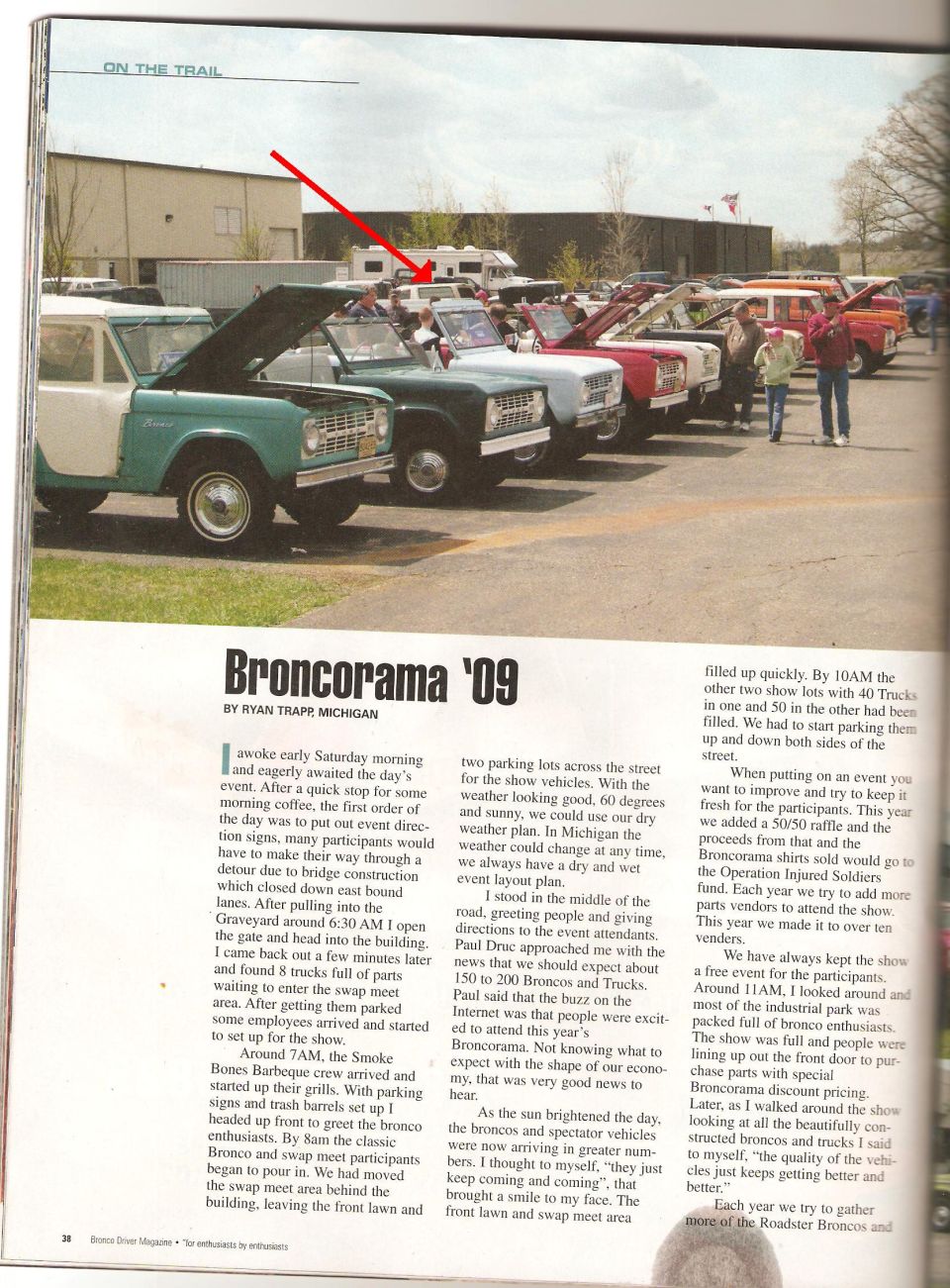 Line of vintage Ford Broncos, some with hoods open, parked at an event