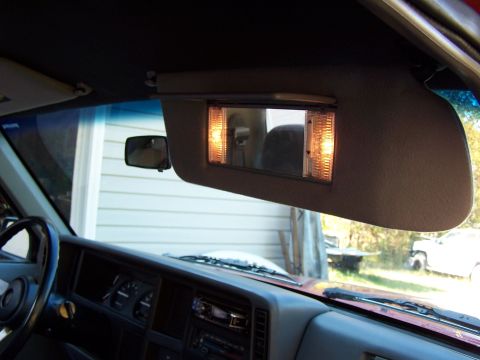 1991 Jeep Comanche - The illuminated vanity mirror is visible on the sun visor inside a Jeep Cherokee XJ.