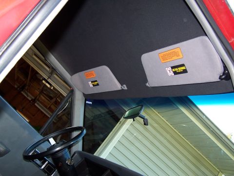 1991 Jeep Comanche - The interior of a vehicle is shown, focusing on the dashboard and sun visors.