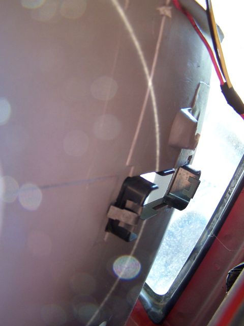1991 Jeep Comanche - Close-up view of a clip and wiring attached to the interior trim of a vehicle.