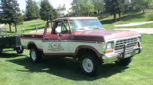 1991 Ford Bronco - This vintage Ford pickup truck is parked on a grassy area, possibly a golf course.