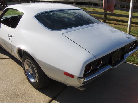1970 Chevrolet Camaro - Rear view of a white 1970 Chevrolet Camaro, its classic design and taillights.
