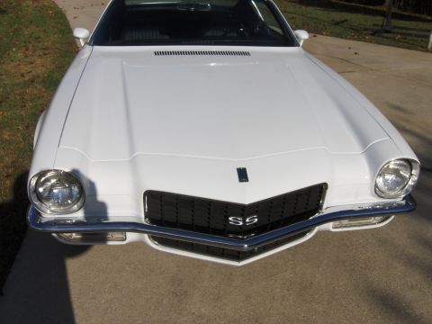 1970 Chevrolet Camaro - The front of a white Chevrolet Camaro SS is shown, a distinctive black grille and SS badging.