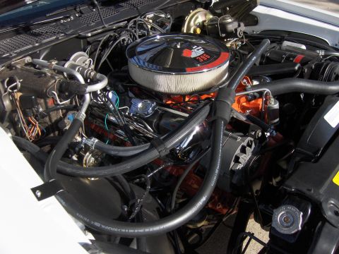 1970 Chevrolet Camaro - Close-up of a V8 engine bay a chrome air cleaner with a '396' badge, indicating a specific engine displacement.