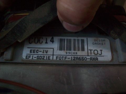 1985 Ford Bronco - Close-up of an engine control unit label with part numbers and codes visible.