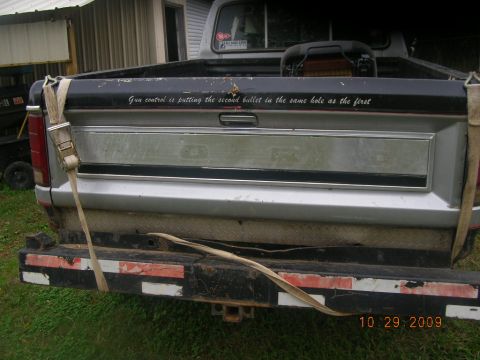 1991 Ford F-150 - Rear view of a pickup truck tailgate with a controversial quote written on it.