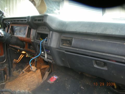 1991 Ford F-150 - Interior view of an older pickup truck's dashboard, showing signs of wear and aftermarket modifications.