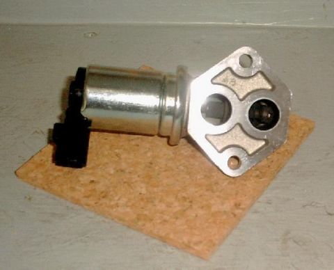 2007 Ford Mustang - EGR valve part shown on a cork pad against a neutral background.