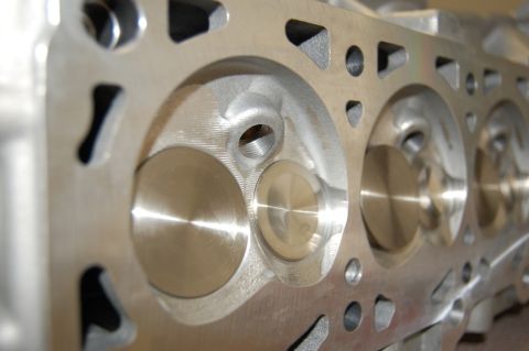 2007 Ford Mustang - A detailed view of a machined engine cylinder head, its internal components.