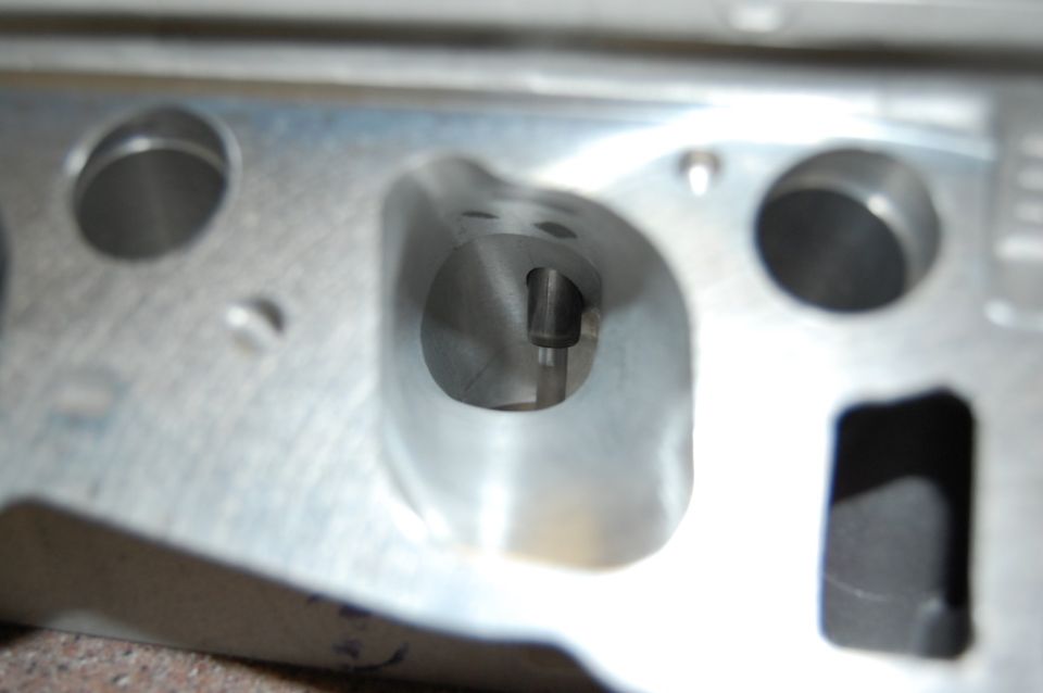 Aluminum engine cylinder head with intake and exhaust ports visible