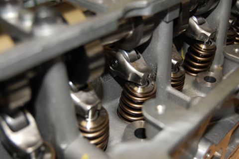 2007 Ford Mustang - Detailed view of the internal components of an engine's valve train, showing springs and rocker arms.
