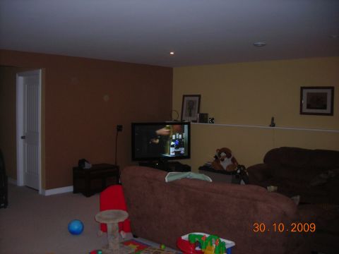 1984 Ford Bronco - Living room scene with furniture, a TV, and toys, dated October 30, 2009.