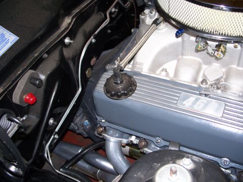 1971 Ford Ranchero - A detailed view of a V8 engine, a prominent "46" emblem on the valve cover and an air filter assembly.