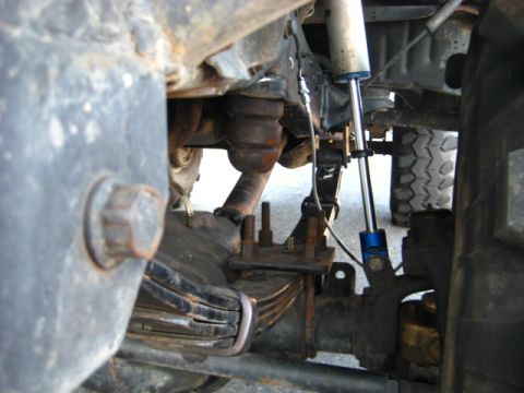 1989 Ford Bronco - Detailed view of the suspension system, showing various mechanical parts and hardware.