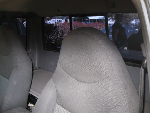 2003 Ford Ranger - View from inside a truck cab, showing the seats and the view through the rear window.