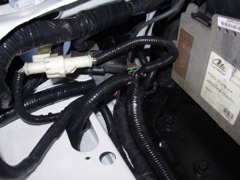 1995 Ford Taurus - The ABS controller module is labeled with part numbers and 'ANTILOCK CONTROL'.