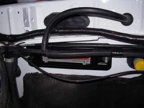 1995 Ford Taurus - Close-up view of an engine wiring harness connector, part of the vehicle's electrical system.