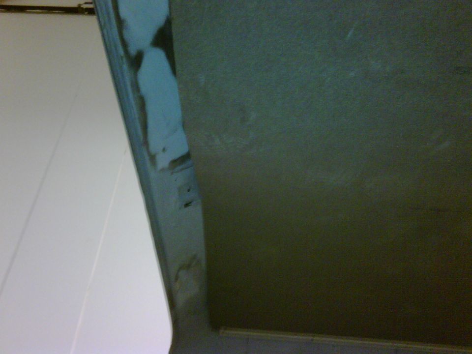 Close-up of an interior door panel with visible seam and textured surface