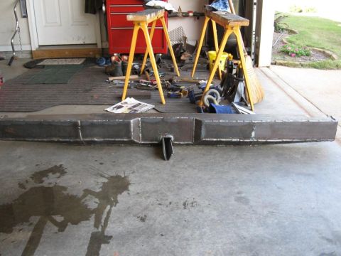 1995 Ford F-150 - A fabricated steel bumper is shown in a garage setting, ready for installation.