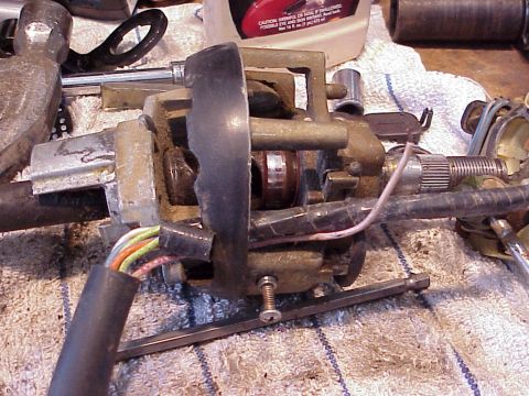 1979 Ford Bronco - Close-up view of a disassembled steering column assembly, showing internal mechanical and electrical components.