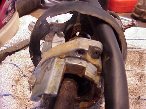 1979 Ford Bronco - Detail of a worn steering column part, likely for repairs, with visible rust and metal components.