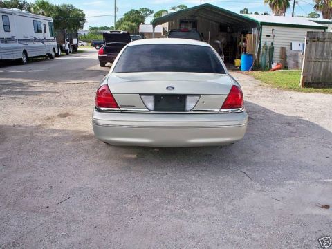 2004 Ford Crown Victoria - This silver 2004 Ford Crown Victoria is shown from the rear, tinted windows and a clean body style.
