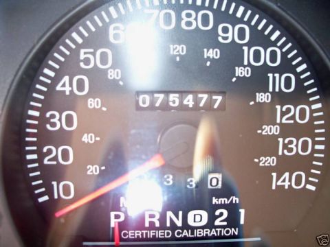 2004 Ford Crown Victoria - The odometer displays 75,477 miles, with the gear selector indicating Park, Reverse, Neutral, Drive, and 2nd gear.