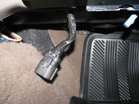 2004 Ford Crown Victoria - Under the passenger side dash.