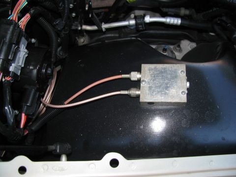 2004 Ford Crown Victoria - In the engine bay, on the passenger side fender.