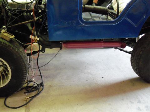 1978 Jeep CJ5 - Side view of a 1978 Jeep CJ5 body during restoration, showing the frame and exhaust system.