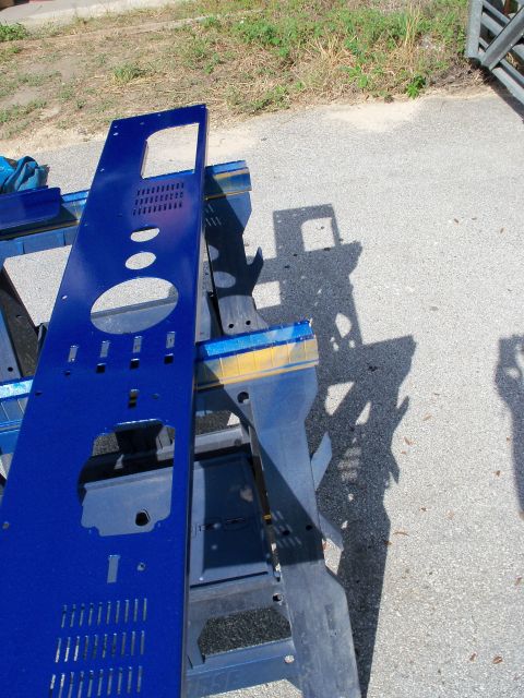 1978 Jeep CJ5 - A blue metal panel, likely a vehicle part, is shown outdoors on sawhorses.