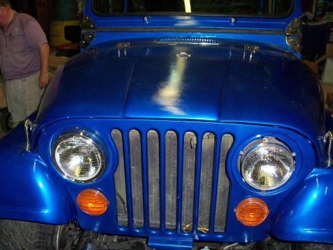 1978 Jeep CJ5 - Front view of a blue 1978 Jeep CJ5, showing the iconic grille and round headlights.
