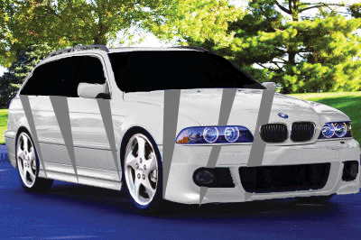 1999 Ford Taurus - A white station wagon with racing stripes is shown from the front three-quarter view.
