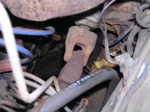 1978 Ford Bronco - Underside view of a vehicle's driveshaft universal joint with surrounding mechanical components and wiring.