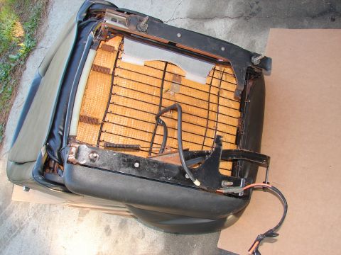 1973 Ford Ranchero - The interior of a car seat, showing the exposed springs, foam, and wiring harness.