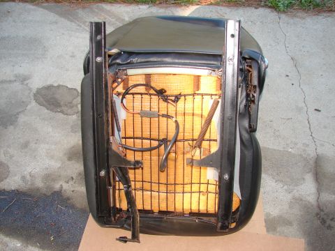 1973 Ford Ranchero - Car seat frame showing internal springs, padding, and electrical components.