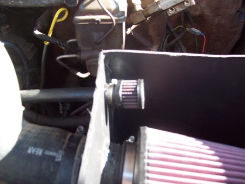 1985 Ford Bronco - Aftermarket air filter installation in the engine bay. The registry claims this is a 1985 Ford Bronco, but the image does not provide enoug…