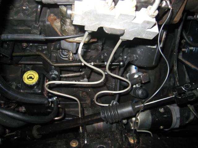 Underhood view of engine plumbing and fluid lines