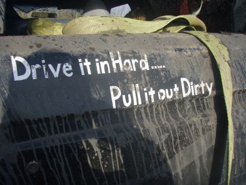 1985 Ford Bronco - This vehicle part features the text "Drive it in Hard..... Pull it out Dirty" and a tow strap.
