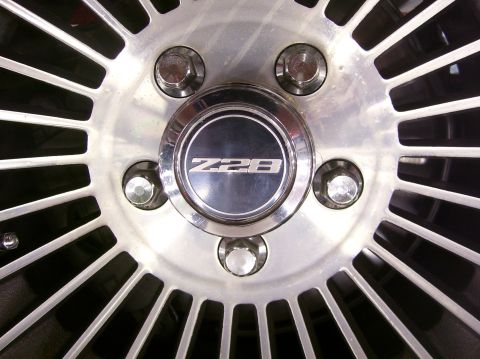1979 Chevrolet Camaro - A close-up shot focuses on the Z28 emblem on a vehicle's wheel hub.