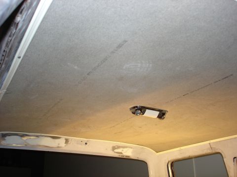 1979 Ford F-250 - Vehicle interior ceiling with a light fixture and faint text visible on the headliner.