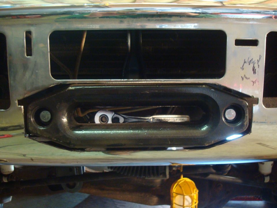 Winch assembly with a ratchet tool inside the fairlead opening