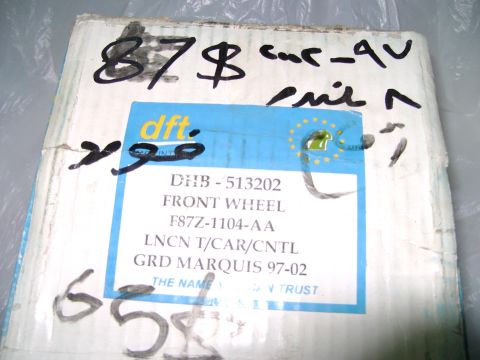 1998 Ford Crown Victoria - Box for a front wheel part, labeled for a 1997-2002 Grand Marquis. The actual vehicle is not pictured.