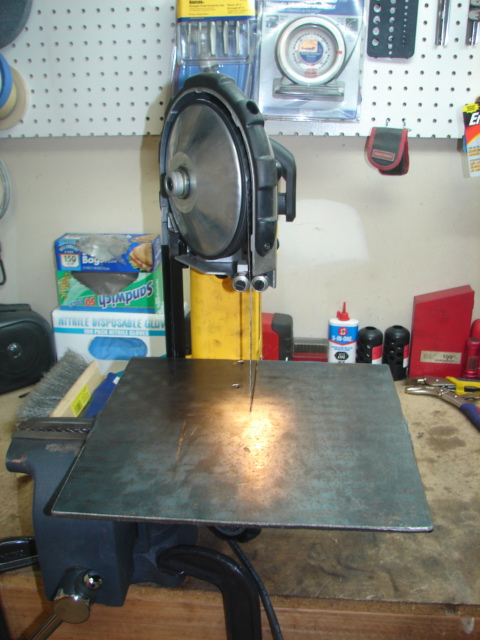 1996 Ford Bronco - A band saw is set up in a workshop, ready for metal cutting operations.
