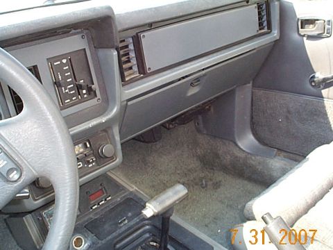 1984 Ford Mustang - Interior view of a 1984 Ford Mustang, highlighting the dashboard and center console.